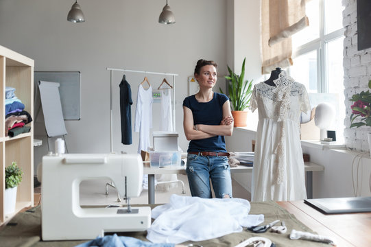 Young thoughtful sewer in workshop
