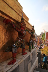 Close up colorful giant lifting the golden pagoda in Wat Phra Kaew,Bangkok Thailand