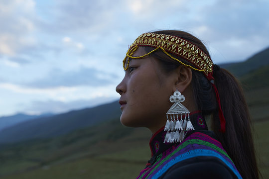 Beautiful Chinese Yi people in traditional costumes  outdoor