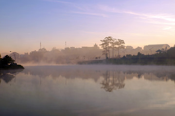 Fototapeta na wymiar Da Lat morning with lake in fog
