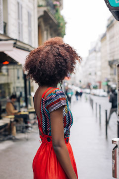 Beautiful African Woman in Fashionable Colorful Jumpsuit Looking Away