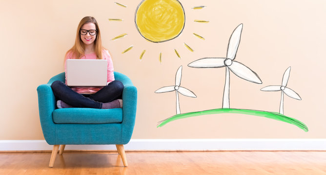 Windmills with young woman using her laptop in a chair