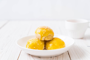 Chinese pastry or moon cake filled with mung bean paste and salted egg yolk