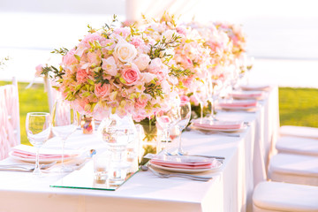 Table setting at a luxury wedding and Beautiful flowers on the table.