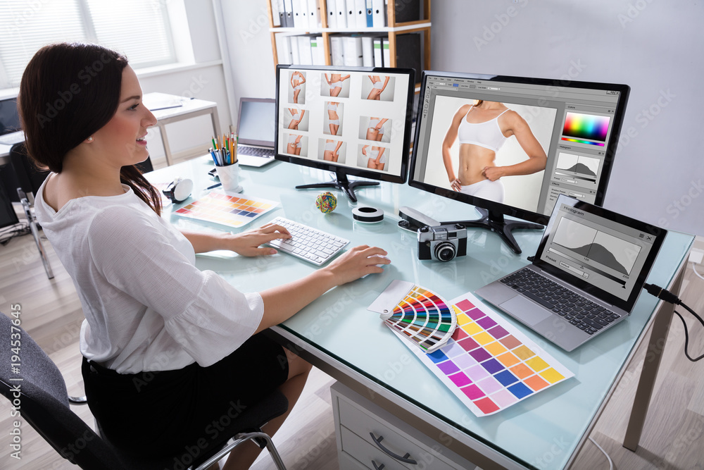 Poster Female Designer Working With Photographs On Multiple Computer