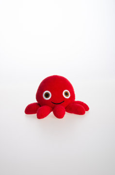 toy or octopus soft toy on the background.