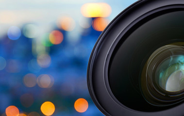 Closeup of camera lens on blur bokeh background