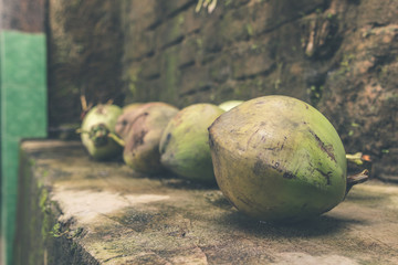Fresh young coconuts. Tropical island of Bali, Indonesia. Exotic raw fruit.