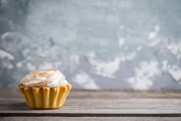 Creamy cake on the rustic background. Selective focus.