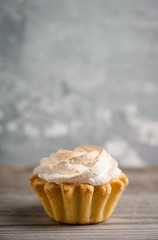Creamy cake on the rustic background. Selective focus.