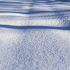 Shadows on snow-covered field