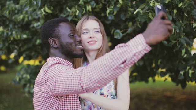 interracial couple take selfie