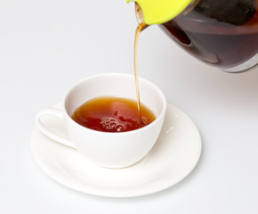 Tea in a cup on a white background