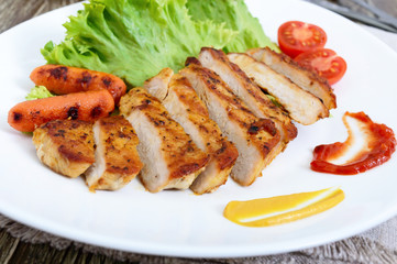 Juicy grilled meat , vegetable, lettuce leaves and sauces. Healthy food.