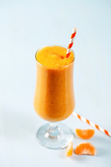 Smoothie from tangerine in a glass