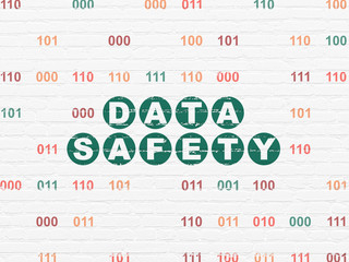 Data concept: Painted green text Data Safety on White Brick wall background with Binary Code