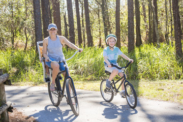 Family on a bike ride together outdoors on a sunny day