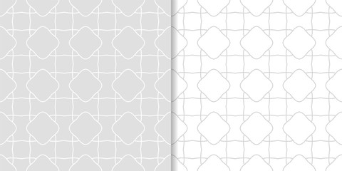Light gray geometric ornaments. Set of seamless patterns