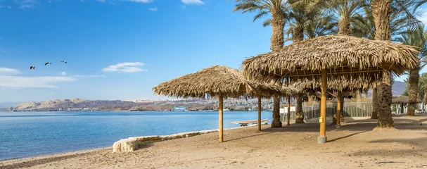 Zelfklevend Fotobehang Morning at the central public beach in Eilat - famous resort city in Israel © sergei_fish13