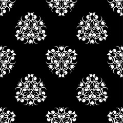 White floral design on black background. Seamless pattern