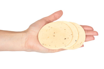 Round sliced cheese with herbs in hand. Isolated on white background. Mushroom and garlic, basil and dill
