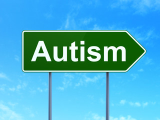 Medicine concept: Autism on green road highway sign, clear blue sky background, 3D rendering