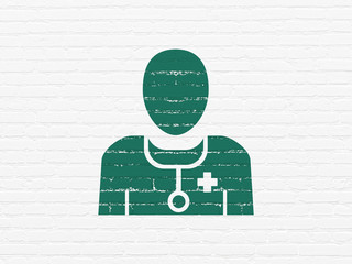 Health concept: Painted green Doctor icon on White Brick wall background