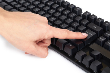 Black mechanical computer keyboard with hand. Isolated on white background