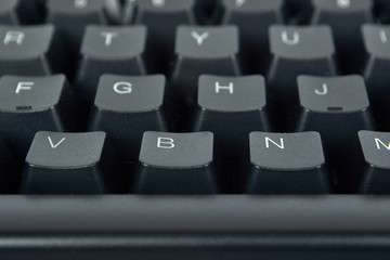 Black mechanical computer keyboard. Macro image, technology background, close up buttons