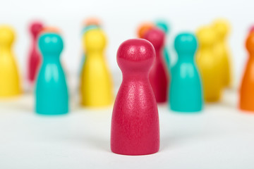 Wooden pawn leisure game figures. Isolated on white background, social idea, immigrants problem....