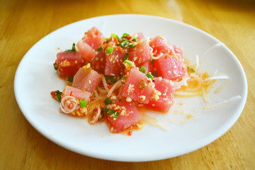 Salmon spicy on the white dish