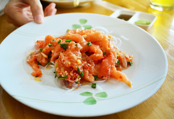 Salmon spicy on the white dish