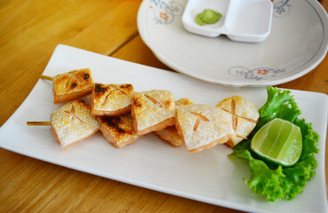 Grilled of salmon on the white dish