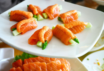 Salmon role sushi on the white dish