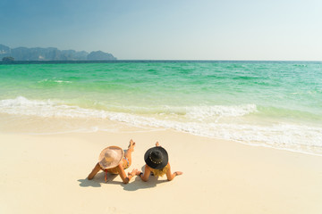 Fototapeta na wymiar Two Women at the beach in Koh Poda island Thailand