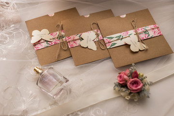 Wedding invitations in the craft envelopes. Wedding concept. Wedding accessories. 