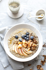 morning oat porridge with fresh fruits and tea