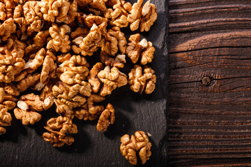 Walnut on a dark rustic wooden background