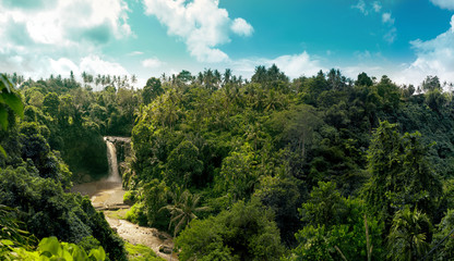 Waterfall panorama in amazonian tropical rain forest with big river in the middle of jungle