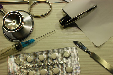 Many different colorful tablets in strips. Medicinal preparations, instruments. Background of...