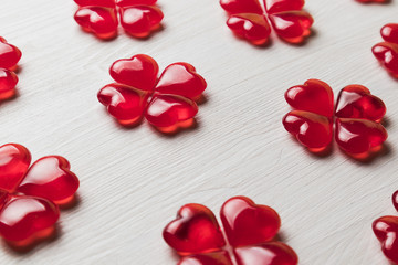 background of red hearts on a white wooden substrate