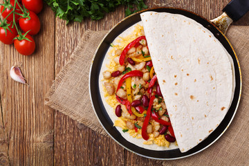 Quesadilla with chicken, served with guacamole or salsa sauce.