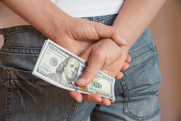 man holding dollars banknotes. close up.