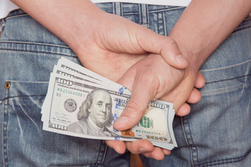 man holding dollars banknotes. close up.