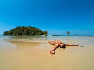 woman resting at the  tropical beach of Klong Muang in Thailand