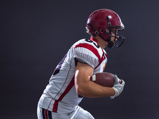 American football Player running with the ball