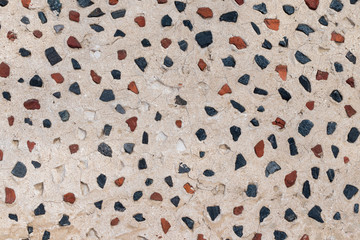 Texture background multi-colored small  stones in the wall