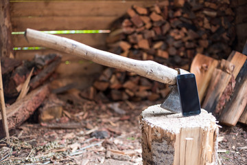 Smartphone on the stump. Smartphone near the ax. The ax in the stump. Firewood. Chopping wood.