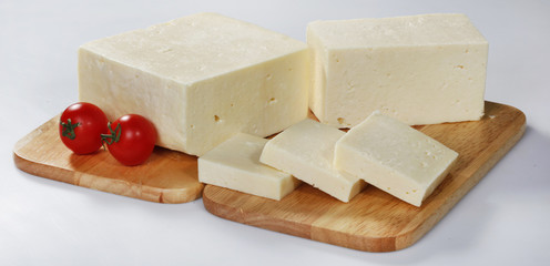 cheese on wooden board isolated on white