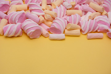 Multicolored marshmallow. Background or texture of colorful mini-marshmallows. Empty space for copying text.